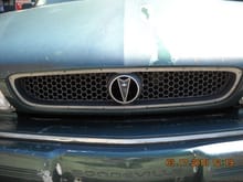 SOMEBODY STOLE THE CHROME TRIM THAT GOES AROUND THE GRILLE.....THEY ALMOST STOLE THE EMBLEM....SAVAGES!!!!