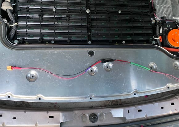 Here's the relay connection. Put the female on the battery side, have a 2A fuse in the middle and the 2 diodes are each covered individually with shrink wrap tubes, and secured together underneath the green shrinkwrap tube. Purple shrinkwrap covers the sodler from the 12 Ga fuse wire to the 18 Ga lead wires.