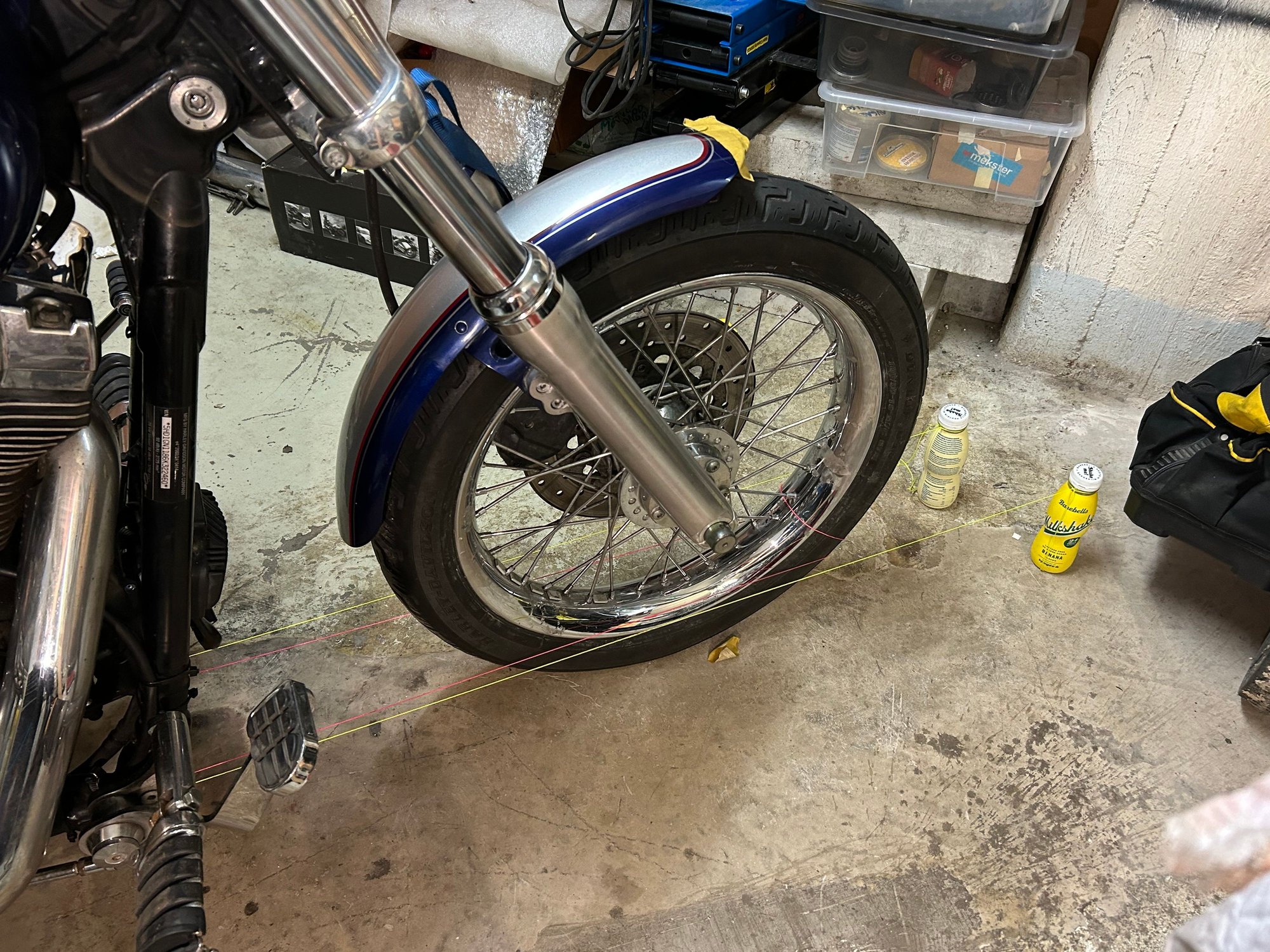 Front wheel not centered between the light green strings