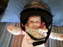 This is what happens when Grandpa gets to watch Mia by himself ;-) - future rider in the making - well when the helmet fits a little better anyway