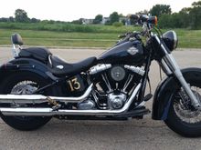 I just completed my deluxe classic conversion using a 7" wide jp cycles rear fender and the factory slim struts. 7 holes had to be filled and 7 added. I also had to cut out the front section for the ecu recess
