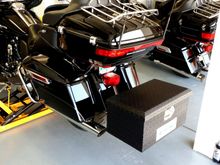 This is what I use on my 14, Hidden Receiver Hitch with box mounted. On the 09 I have a Rivco rack similar to your Kuryakyn, tried numerous coolers/duffle bags back there.