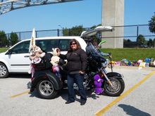 Suzie standing beside the lead bike.
