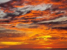 THe sun is already disappearing behind the cloud cover.