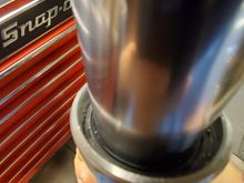 Make sure the seal is driven deep enough to fully expose the retainer ring groove in the slider