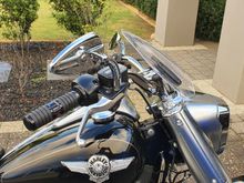 I've set it to this angle, as a 5'10" rider with a Sundowner, and a 5'9" Mrs, this puts our helmets in clean air and there is no wind on our chests, also Mrs reports there is a lot less wind on her coming on from the sides.

I got the clear as I want to see what it looked like but I'll cover it in vivid black vinyl to see what it looks like too 👍🏻 oh and to hide the handlebar bag I have to fit lol.

