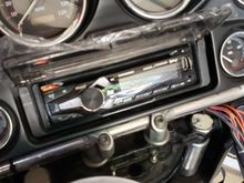 New and modern head unit with bluetooth, usb, spotify. Yeah, I sacrificed thumb controls but I can always go back to reinstall them if needed.