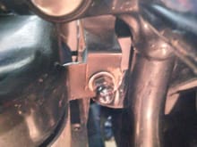 you can see where its's mounted , normally its supposed to go between the frame tab oil tank mount . . .