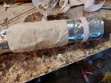 I used solid aluminum high temp tape to seal and secure the packing. 