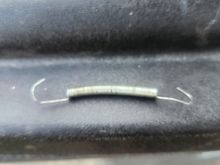 I was doing an oil change on my 2015 Street glide special with a 103 and I found this spring right below the oil cooler any ideas where it goes?  Any input would be appreciated.