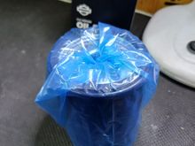 Filter wrapped in plastic bag.