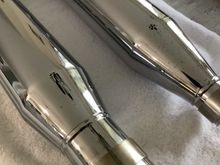 You can see the black spots on both mufflers in this picture 