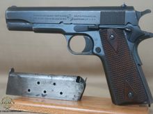 Colt M1911 made in 1917 
Says Property of the United States on the side. 