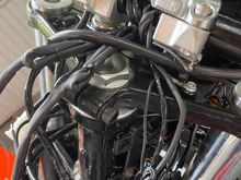 Clutch line going across the fork neck and zip tied to the riser. 