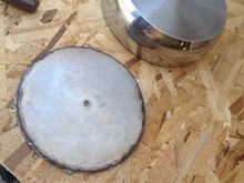 I picked up a couple of stainless sauce pans from the local Goodwill.  One for the main body and another to build the medallion.  I cut both pieces with a plasma cutter.  I had a jig in the center hole with an arm to hold the plasma cutter to make a circle.  The main part of the air cleaner needed to be cut shorter to clear the backing plate.