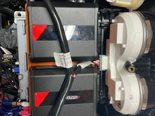 Amps mounted and the they clear finally.  DSP mounts on a plate on right hand side using the speaker pod mounting holes.  Have to remake the “shelf” on the left side to hold the power distribution blocks. 