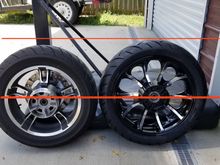 Obviously no exact number for difference but here is a little line showing the stock 16 next to an 18 with a 180/55/18 tire. 