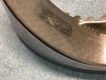 This is the only mark that can be felt with a fingernail, but just barely.