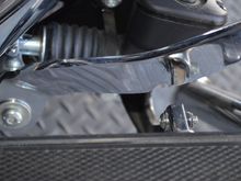 slight wrinkle in the chrome and the notch to clear pedal extension.
