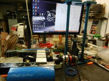 3. Clamp the shaft than remove the piston nut, piston, than the compression side shims to re-valve the shock.  Notice the build sheet of every item in the shock and new shim pack to be used.  This is my own design on how to make a shock to work the way I want it to.