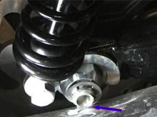 Make sure the C-Clip does not kit the muffler which will happen with shocks over 13".  This occurs when the rear wheel is off of the ground