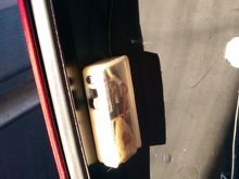 Double-sided taped, sits directly above where the liner sticks out with the tour pack wiring, so not likely to get shut against something.  Plus virtually no chance that a slide switch will accidentally get bumped.