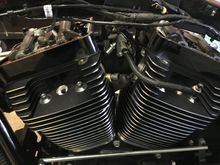 Next I removed the covers, and the throttle body. Each cover has 6 fasteners, the left side of each cylinder are short, and the right side long. It does show where they go in the service manual. The throttle body and injectors/fuel line all come out together. 2 Allen heads on each side of the throttle body. I used a small Allen wrench on the left side of the motor, and an Allen key, with a long 1/4 in extension and ratchet for the right side. I removed the sensor on rhe throttle body first.