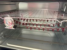 Originally was using Xmas ornament hooks.  But handling each one was not going well. Also, the faraday effect was killing me with the large hook. 
Used some channel looks and some utility wire I had, and bent up a bunch of these.  Could get 12 on a strip, and the shape helped eliminate the faraday effect. 