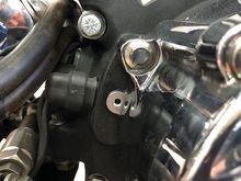 There's the little hole oil was oozing out of..I have no idea what was there.  We didn't remove any screw from that area