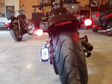 Here's my Kuryakyn one. Took awhile to install cuz of a tidy light wiring, but I like it. Be a prob if ya wanted saddlebags, but I don't like anyway.