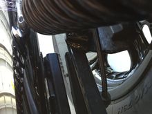 Had to remove exhaust bracket and bend outward slightly to gain clearance at the swing arm.