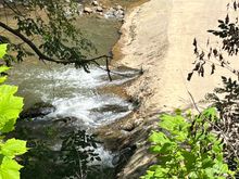 Crick behind the shop… a swinging bridge goes across 
