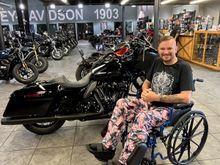 Sitting proudly next to my new bike. Apparently, they didn't care I couldn't ride away, as long as my money was green.