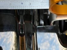 Measured the distance between the bracket & fender and split the difference. 