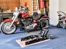 The J&S was stored to the left side of the bench in the picture behind the bike.