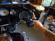 These bars are the same width and about a half inch higher than stock bars, so the stock mirrors still work just fine.