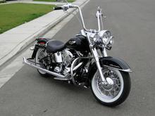 2010 Deluxe, w/true duals 33'" Samson Fishtails
14" Chubbys w/1 1/2" risers,Road King stock Bags,
Harley Goodies extentions.