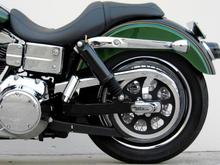 **Rear End**
*Grinded down rear foot peg stops so pegs will tilt in more when in the up position
*H.D. 2007 Street Glide Air Shocks 
*Modified lower belt guard
*H.D. Script Rear Axle Cover Kit 
*H.D. Tinted turn signal lenses
*Custom Chrome lay down pyramid license plate mount  
*Kuryakyn Deluxe Smoked Tail Light 
*Painted LED light face plate and inside of lens sides flat black