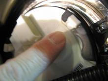 Mounting bracket for Speedo is held on in three places - gently pry fingers off.