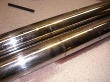 Fork tubes showing damage...one leaked past the seal, the other hadn't.  2009-Mar