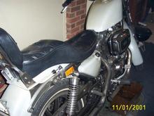 #1 032 rebuilt this past winter its no longer green its primer grey with a light coat of satin clear.got new seat.king sportster tank 3gal.bendix carb.none adj.main jet.its better than the butterfly khienen made for an 85' sporty.rewired bike myself with fac. man.specs.starts great runs geat.stock bore but honed .001ths.in.new fac.stock pistons  rings.lower end checked out like new,as did tranny,primary,heads,valves,cams lifters.i still need an exhast.im still running open drags front pipe ex.dia.is 2in.wheras the rear ex.pipe is 1.75i. or 13/4 in outside dia.