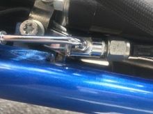 THE LOWER REAR CHROMITE BRAKE LINE CABLE
