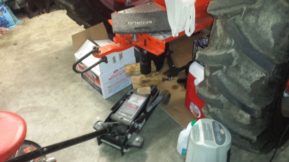 Use the floor jack to "press" it into place