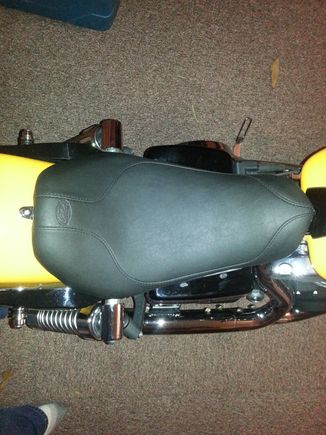 I did a write up on this seat.  Don't know where it went. 
Just got the seat on.  So far it is very comfortable.  Lol!
I'm 6'2" and it definitely drops you back and down. The sitting surface looks to be same as stock. If the temp ever warms up, I'll write a review. Haha. Overall a cool looking look. ..