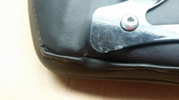 Tiny hole. Not noticible when mounted.