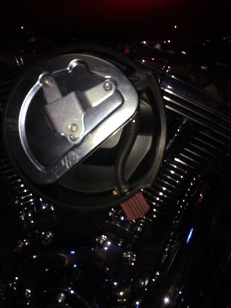 I had drilled a 3/8 hole at 5 o'clock and pressed in the breather nipple so the breather sits flush on the air box. The clamped hose hold the breather element firmly in place.