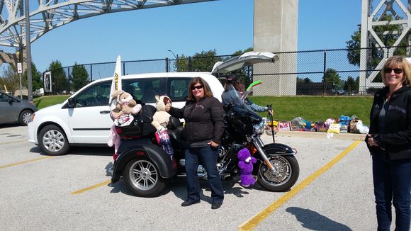 Suzie standing beside the lead bike.