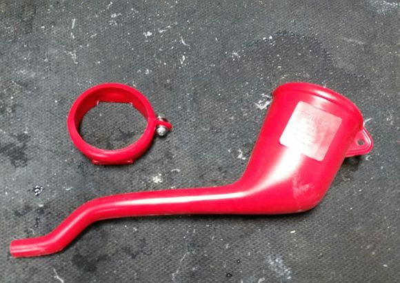 I cut the top off a Redline oil funnel to form the top of the cup holder.