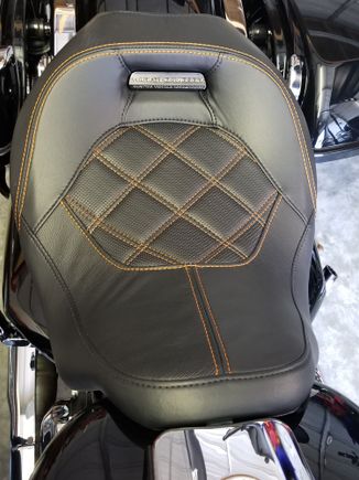 This is from a 2018 CVO Street glide but I would imaging the seat is the same other than the cover.  I don't have a lot of miles on it yet but so far I like it.  Definitely firmer than the 2017 stock seat.  Sits a little lower and puts you back just a tad.  I liked the lip behind my back on the stocker, this one doesn't have that, not solo anyway.  Good luck with your decision!