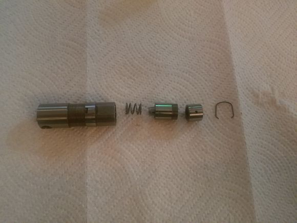 this is how the "C" lifter comes apart, note the 2 piece plunger. more on this later